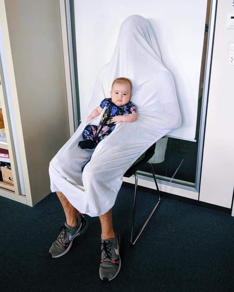 Passport worker - We're gonna need the baby to sit on the chair for the photo.

Dad - She won't let me put her down.

Passport worker - You're gonna need to figure something out if you want a passport picture.

Dad - I got an idea...