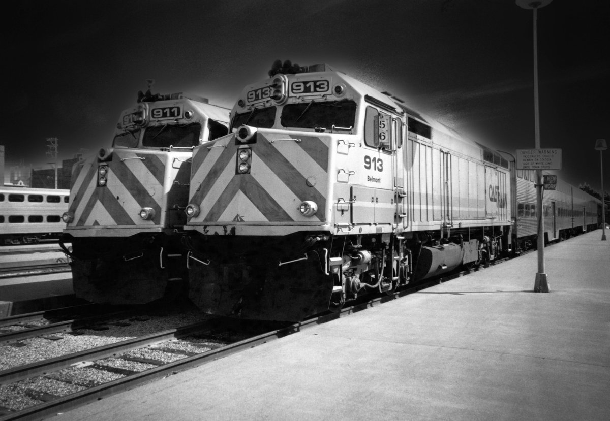 Black and white photo of Caltrain with dark sky