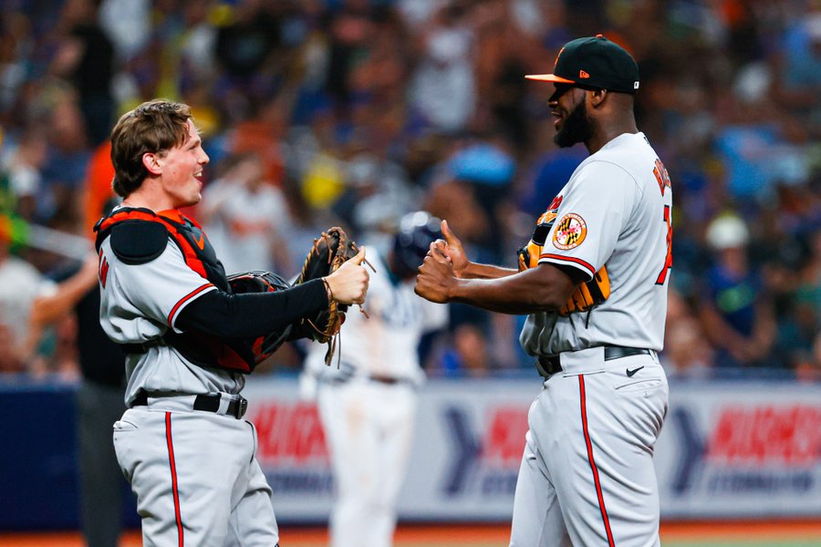 Adley Rutschman and Félix Bautista celebrate after the O's win.