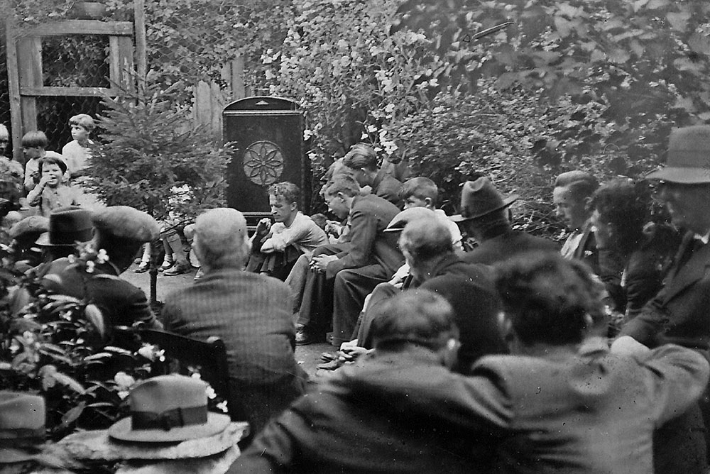 Gathering around listen to the All Ireland Hurling Final between Kilkenny and Limerick 90 years ago. Neighbours gather around a wireless radio at 19 O'Neill St, Clonmel, Co Tipperary Photo by Christy O'Riordan