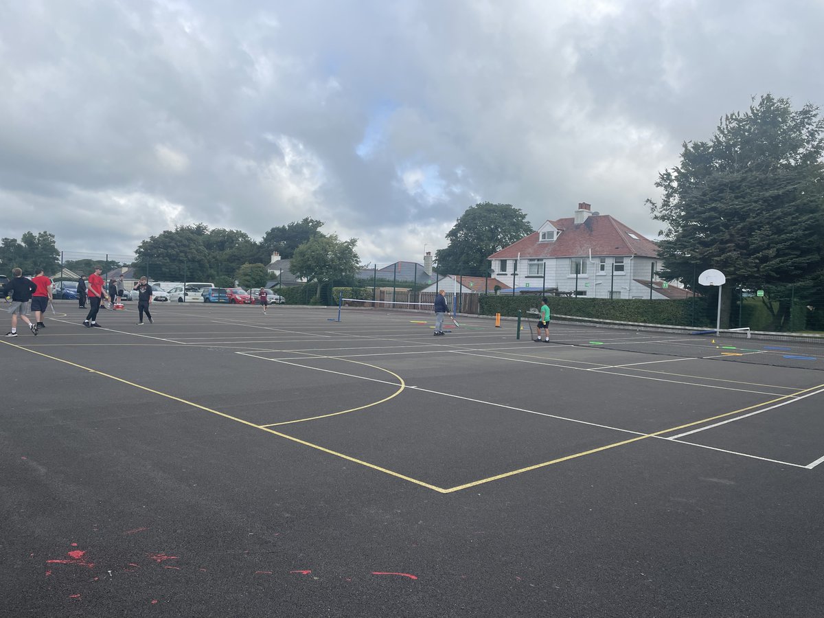 Tennis - the students are enjoying themselves and are practising their technique.