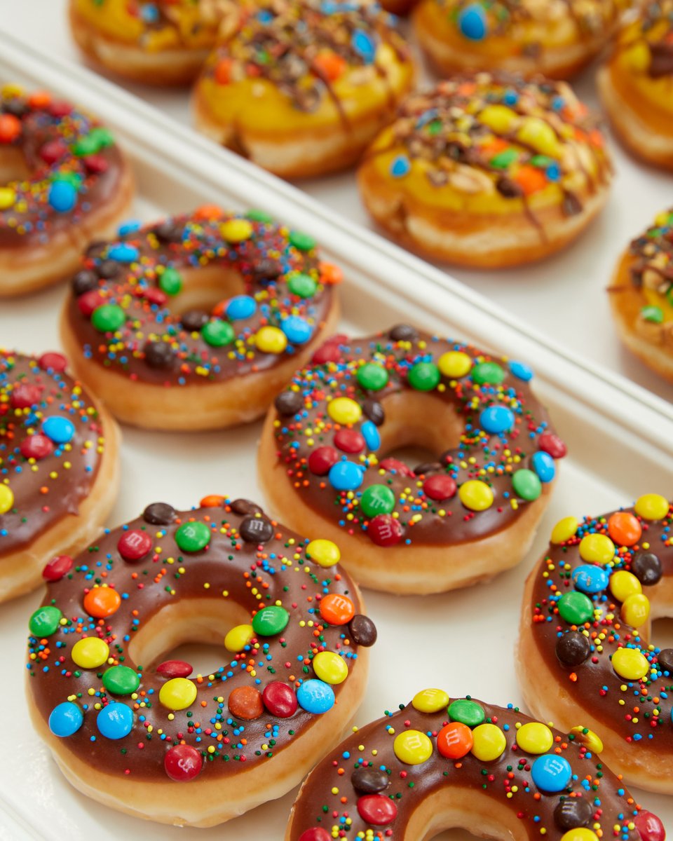 krispykreme's tweet photo. Drooling over these doughnuts made with @mmschocolate 🤤 Reply with a GIF or emoji that describes this pic ⬇️ https://t.co/S01zmIklau