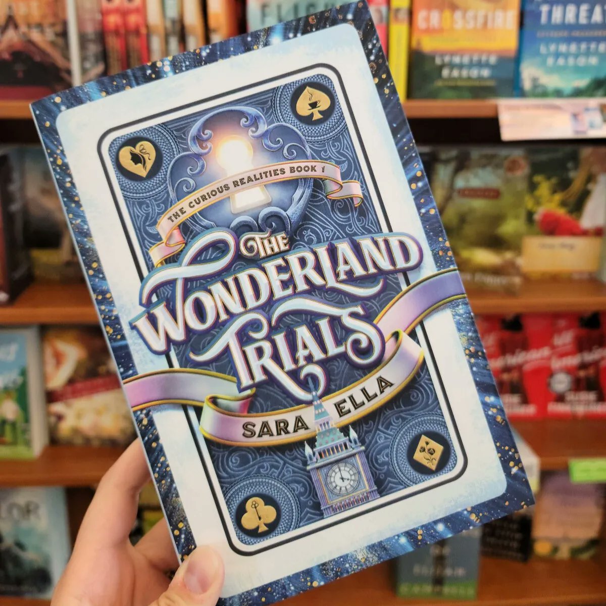 "Reading this book swept me into a topsy-turvy world! Alice in Wonderland was one of my favorite books growing up and this book was full of whimsy with a unique dystopian spin," says Toni, one of our bookstore's supervisors. 

Find The Wonderland Trials by Sara Ella in-store.