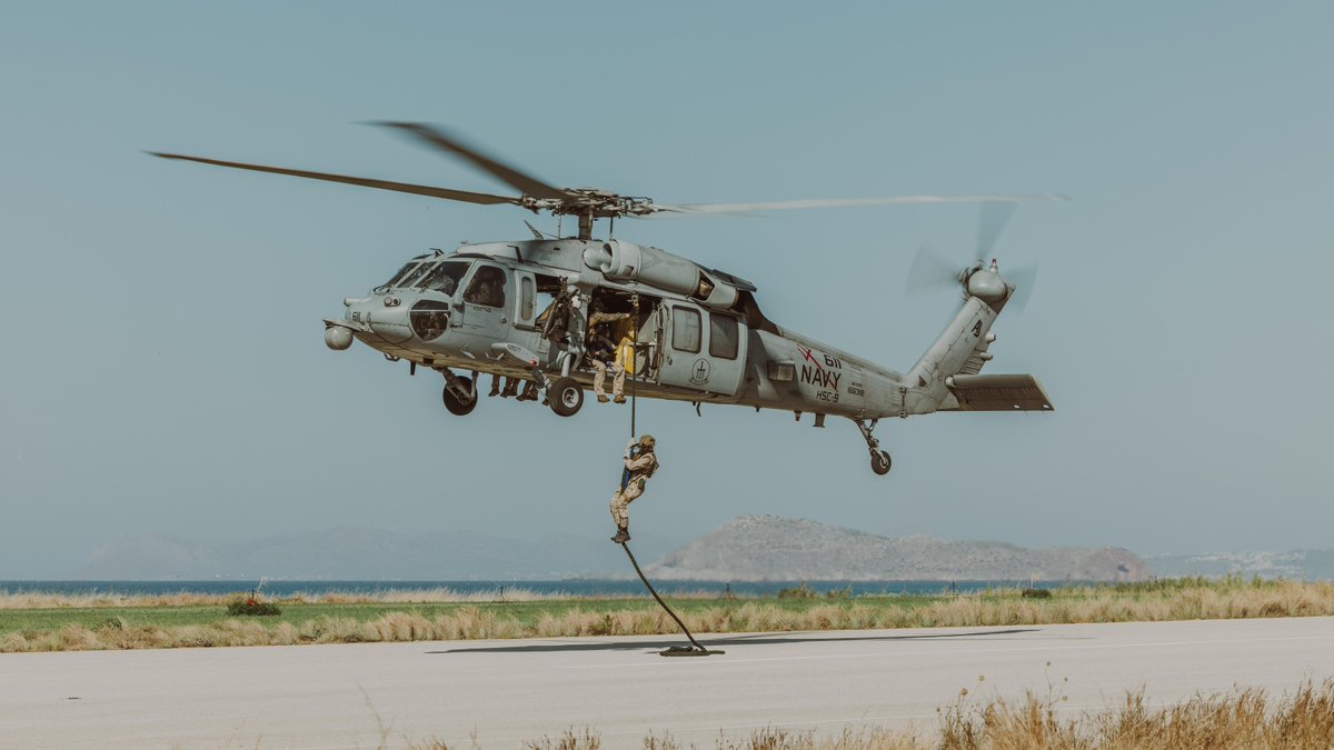 USMC's tweet photo. #Marines with @2dMarDiv fast rope out of an MH-60S helicopter in Greece, July 19. 

These Marines help provide naval and joint force commanders with dedicated multi-domain reconnaissance and counter-reconnaissance capabilities. 

#USMC #MarineCombatArms https://t.co/6yE0dvoKpy