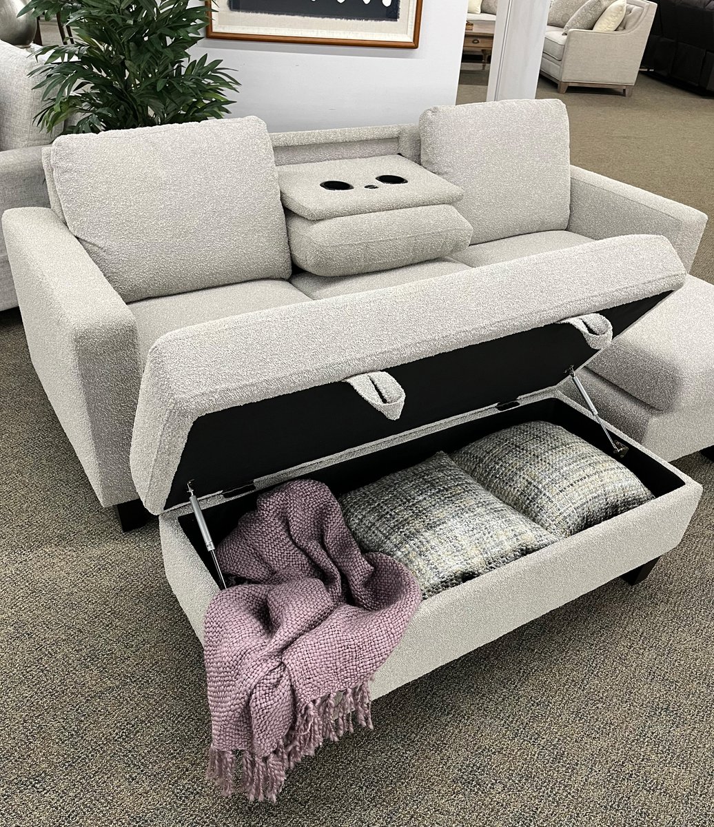 Tuck blankets and pillows and more into the spacious Dawson the storage ottoman! Push it up against the loveseat to instantly create additional leg space. Snuggled up in a textured gray fabric, Dawson (U4121) is the ultimate in casual, effortless style with convenience. ✨