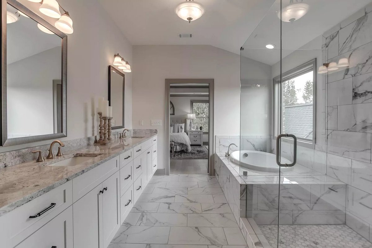 Who else loves a bathroom full of {marble}ous details? 🙋  Revel in bathroom designs from SR Homes here: bit.ly/3loWti7 #SRHomes #AthensRealEstate #BathroomDesign #MarbleBathroom