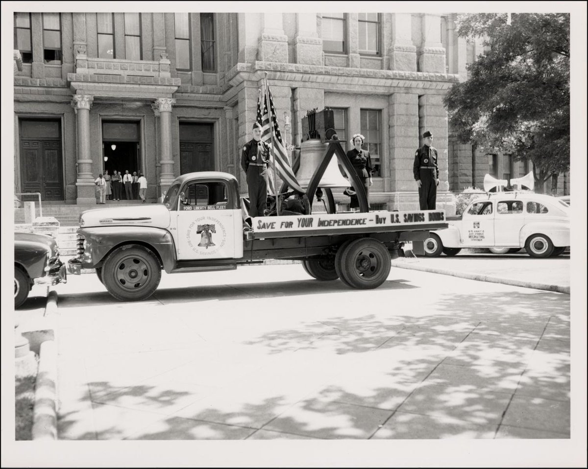A Ford f-5 pickup truck  with a model of the Liberty Bell in the back. Painted on the truck's bed rail is the motto "Save For YOUR Independence - Buy U.S. Savings Bonds." 🇺🇸🇺🇸🇺🇸
Unknown date, but from WWII period. #txlege