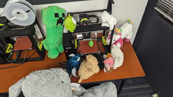 GeneseeLibrary's tweet photo. What's on this evening's agenda at Stuffed Animal Sleep Away Camp? Playing with the library's 3D printers! https://t.co/mP9m1PMknQ