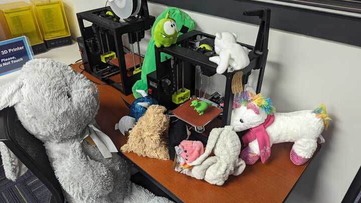 GeneseeLibrary's tweet photo. What's on this evening's agenda at Stuffed Animal Sleep Away Camp? Playing with the library's 3D printers! https://t.co/mP9m1PMknQ