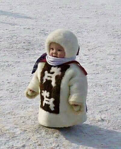Inuk child in her first parka.