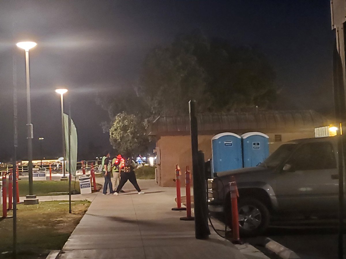 EternalZan's tweet photo. @HallHLine They are handing out A group wristbands near two blue port-a-potties across the parking lot behind Joe's Crab shack. The green flag is on the left of this photo. Head for the water. They checked for my SDCC badge and ID. https://t.co/7QNK6RzJ6e