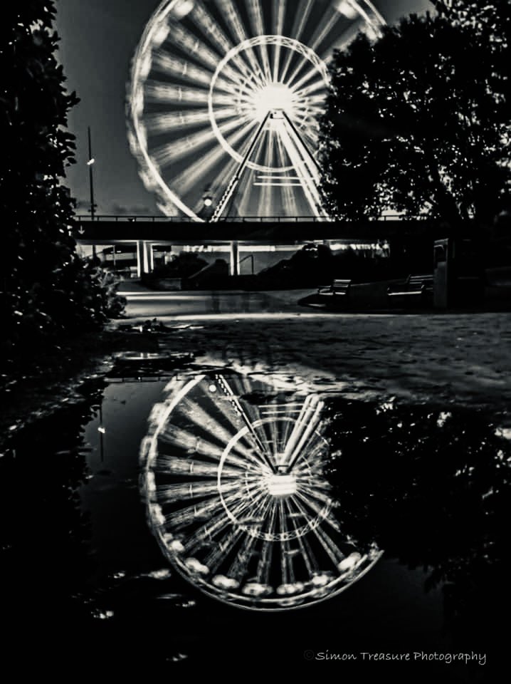 Simon_Treasure's tweet photo. One from the archives and re edited 
Wheel reflection 
#balckandwhite #bournemouth #Reflections #ferriswheel #puddlereflection #bournemouthconnect #lovebournemouth #photograghy https://t.co/2tJHPNE4Qi