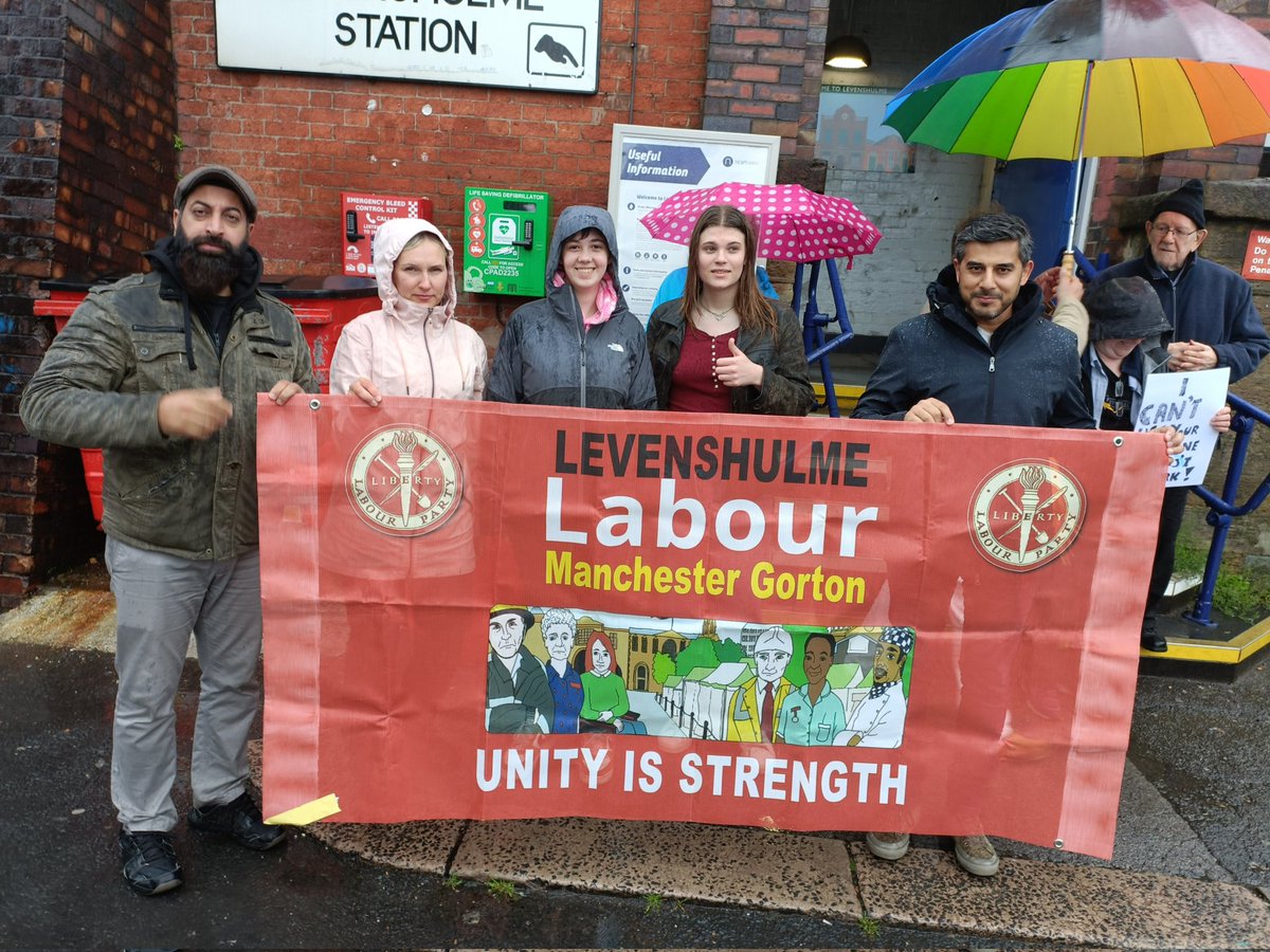 LevenshulmeLab's tweet photo. Despite the rain, Levenshulme Labour cllrs and members are out protesting the closing of our ticket office, and standing in solidarity with @RMTunion members fighting for a funded, modern railway https://t.co/i1o1WJCjCD