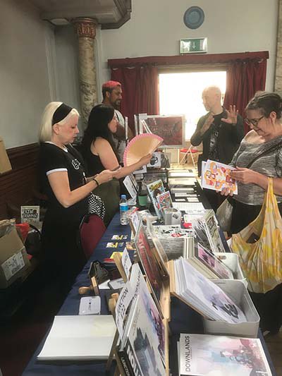 Broken Frontier (@brokenfrontier) on Twitter photo The Broken Frontier table at #slczf #slczf2023 <a href="/slczf/">SLCZF</a> last week with our special guest <a href="/sxbond/">Shelly Bond, offregister.press</a> and #bf6towatch artists @ElKryken and <a href="/shanefaced/">shanefaced</a>. #comics #smallpresscomics The Broken Frontier table at #slczf #slczf2023 <a href="/slczf/">SLCZF</a> last week with our special guest <a href="/sxbond/">Shelly Bond, offregister.press</a> and #bf6towatch artists @ElKryken and <a href="/shanefaced/">shanefaced</a>. #comics #smallpresscomics