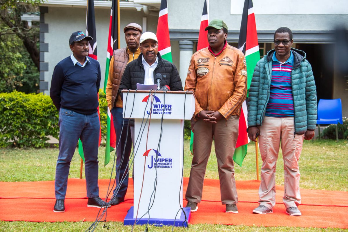 AzimioTv's tweet photo. GENOCIDE UNDERWAY IN KENYA: JULY 22, 2023

We meet here under very sad and traumatizing circumstances. A state-sanctioned genocide is underway in Luoland, particularly in Kisumu, Migori, and Homa Bay. A similar atrocity is also underway in parts of Nairobi, including Kibra and Mathare.

In Kisumu, people are being pulled out of their houses and shot or clobbered to death by police officers. In Migori and parts of Homa Bay, police are going into villages away from towns and shooting or clobbering people to death.

All the elements of the making of a genocide are present in the developments in Luoland. Victims are being dehumanized. There is organization, and the attacks taking place are clearly planned. The perpetrators are clearly trained, whether they are police officers or goons. They are under a command structure and are well-resourced with the arms they need.

There is stigmatization and polarization accompanied by propaganda that the community is behind the nationwide protests. There is preparation, with perpetrators knowing when to attack which area, and they are using what appears to be the adopted slogan of "dealing with the Luo once and for all," very similar to Hitler’s so-called Final Solution. The attackers are working hard to create fear in the community by parading armies, equipment, and weapons.

Victims are identified because of their ethnicity. They are segregated into ghettos. They are being starved, and their property is being destroyed or skirted away. Murders are taking place in ways that are a deliberate and systematic campaign of violence.

This crackdown has been concentrated in slums and other low-income areas of the county where the so-called hustlers, in whose name and interests the Kenya Kwanza regime claims to govern.

We condemn the unacceptable and illegal massacre of the Luo community, whose only crime is to participate, alongside other Kenyans, in protest against Kenya Kwanza policies. We condemn and demand an immediate end to the traumatization and profiling of the Luo community, particularly the children who are being made to pay a price they do not understand.

The genocide underway in Luoland is not accidental. It is coordinated and premeditated. It is being coordinated by political and government leaders both from the community and outside. But it is not just in Nyanza.

In Mathare and Kibra in Nairobi, citizens were brutalized, and tear gas canisters lobbed into their houses. A father who confronted police for hurling tear gas into his house, causing his child to faint, was manhandled and bundled into the police lorry like a criminal. His whereabouts remain unknown.

Several people were shot dead at close range by nonuniformed and uniformed police in Nairobi, Nakuru Mlolongo, and Makueni. Police, mainly in plain clothes, shot and killed citizens, a majority of whom were going about their daily business, and others right at their places of work. Similar executions have occurred in Kisii, Busia, Kericho, and elsewhere in Kenya, all in the name of stopping citizens' exercise of their constitutional right to hold peaceful demonstrations.

Much as Ruto tries to depict Azimio demonstrations as violent, it is evidently clear that our demonstrations are peaceful, and it is the police who import violence and use of excessive force into them. We remind all that whenever Azimio holds rallies and demonstrations without police interference, they end peacefully without violence or distraction.

The decision by Police command to force access to homes is sharply and unnecessarily escalating tensions and costing lives. Inspector General of Police Mr. Japhet Koome and CS Interior Prof Kithure Kindiki must immediately withdraw police officers from people’s homes and residential areas, especially now that there are no demonstrations.

The developments in Nyanza take place against other equally worrying actions by the State. Both police and hired goons are trailing, arresting, and shooting people from vehicles with foreign number plates. In the three-day demonstrations that ended last Friday, South Sudan and Tanzania number plates were visibly deployed. This creates unnecessary tension and conflict between our country and these friendly countries and our people against the people of Tanzania and South Sudan.

As police battle our people on the streets, they have also taken over the corridors of justice in our courts. We saw police attacking families of people seeking Justice in court. We saw Hon. Babu Owino being abducted and ferried away from court corridors after being released on bail. We saw the media being attacked and chased from court corridors as they did their job of informing the world of developments in the country. Azimio leaders are being put under house arrest, constant surveillance, and persistent threat of being arrested.

We demand the unconditional release of all the Azimio leaders and supporters who are still being held incommunicado.

These developments also happen against the backdrop of constant verbal unwarranted diatribe against Uhuru Kenyatta, the fourth president of Kenya, and Ruto’s boss for ten years 2013-2022 August. The withdrawal of security of his mother Mama Ngina Kenyatta, the attack on his son Jomo by ununiformed people claiming to be police, and the attack and vandalization of the Kenyatta family Northlands farm. These are all acts of grave provocation not only to Uhuru Kenyatta and his family but also to all right-thinking Kenyans.

Clearly, Ruto has, for all intents and purposes, suspended the constitution of Kenya and is following his whims. We shall not watch helplessly as Ruto and his cronies completely dismantle the Republic of Kenya as set up by our constitution. We shall not surrender our rights, including the right to life, dignity, and the right to peaceful protest. We shall not surrender our voices or agency. We shall fight for our rights as we have fought for them before and as our fathers fought for them before us.

We call on all right-thinking members of society to rise up and be heard. Let us all say enough is enough. William Ruto and his illegitimate regime must listen to Kenyans. All these actions by police undermine the rule of law and the constitution. These actions point to the emergence of a police State in Kenya. However, these actions, that have left scores of Kenyans dead, have earned police praise from Mr. William Ruto.

We wish to make it clear that our people will not surrender or be cowed. We further make it clear that we will pursue no engagements with Kenya Kwanza whatsoever until these hostilities and their perpetrators are apprehended.

We remain determined to right the wrongs being inflicted on our people, including the state-induced high cost of living. Our peaceful countrywide demonstrations continue next Wednesday. We are serving notice to all the OCSs across the country for the Wednesday peaceful demonstrations. In the meantime, the signature collection, which now stands at 8 million, continues.