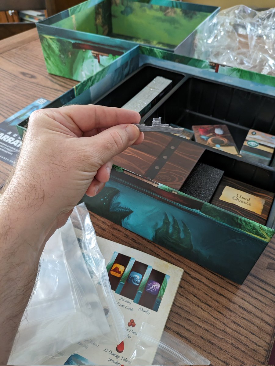 Bizpad's tweet photo. Finally cracked the shrink on our copy of Sleeping Gods and prepped for our first campaign (so we can hit the ground running when we get the chance).  Unfortunately, I also found that the Manticore had seen better days even before embarking on our first journey.  Excited to play! https://t.co/9IgGGdlIh6