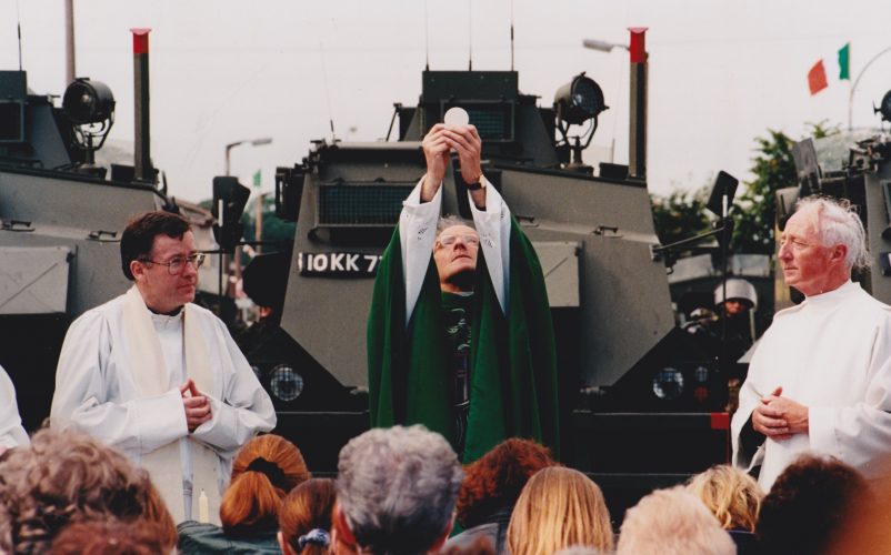 1998, North of Ireland 

Catholic priest says Mass in front of British tanks after soldiers blocked their church in order to facilitate march by anti Catholic hate group
