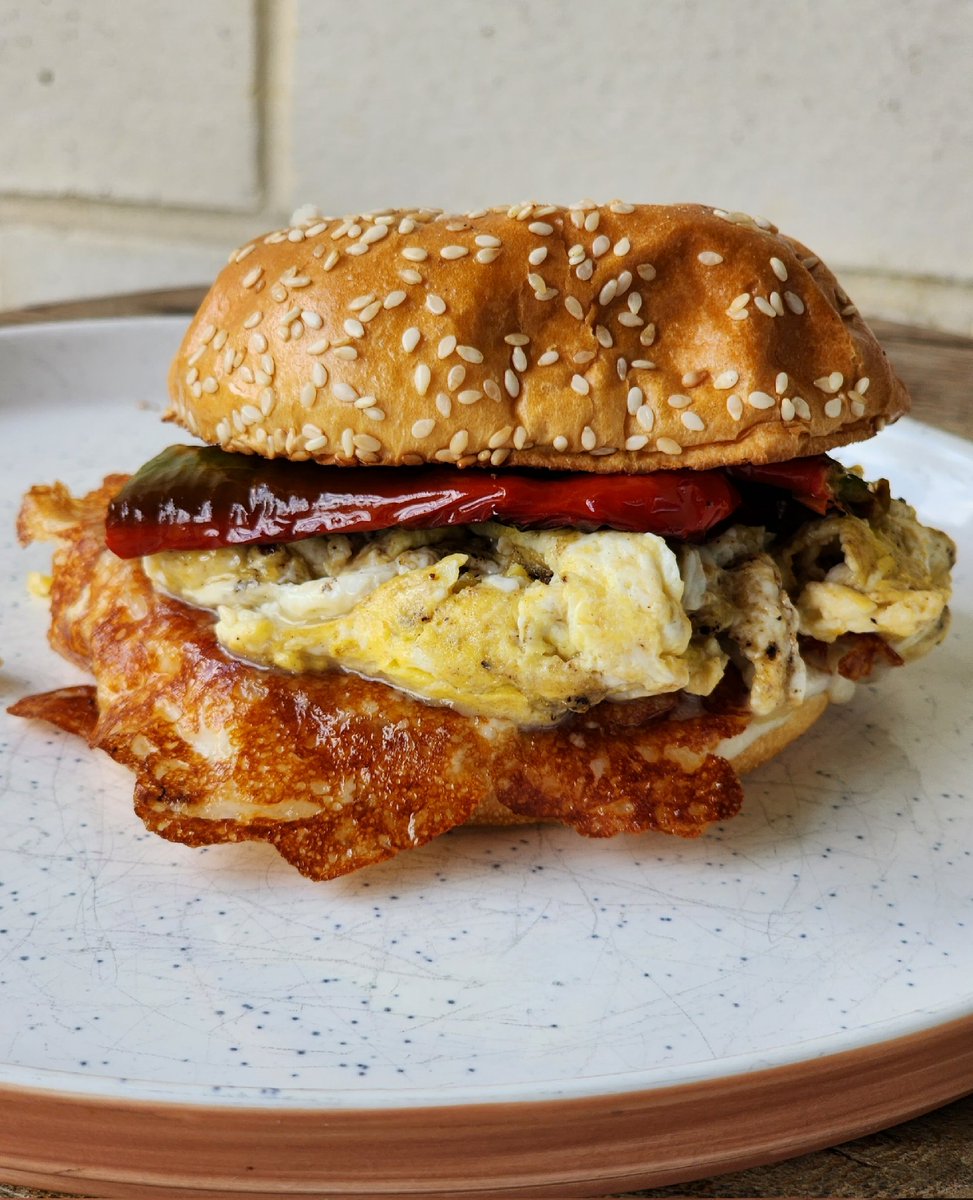 Picked up some beautiful Jimmy Nardello peppers @greencitymarket and made a simple killer breakfast sandwich.

Pan fried Jimmy Nardellos, scrambled eggs, mozzarella cheese skirt, on toasted sesame seed brioche.