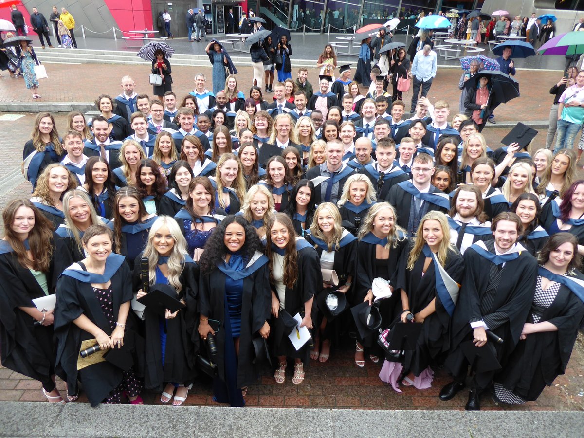 <a href="/UoS_Physio/">University of Salford Physiotherapy</a> graduates looking full of joy (despite the slightly damp conditions) just as it should be. Thank you all for choosing to start your physio journey at Salford, its been a blast!