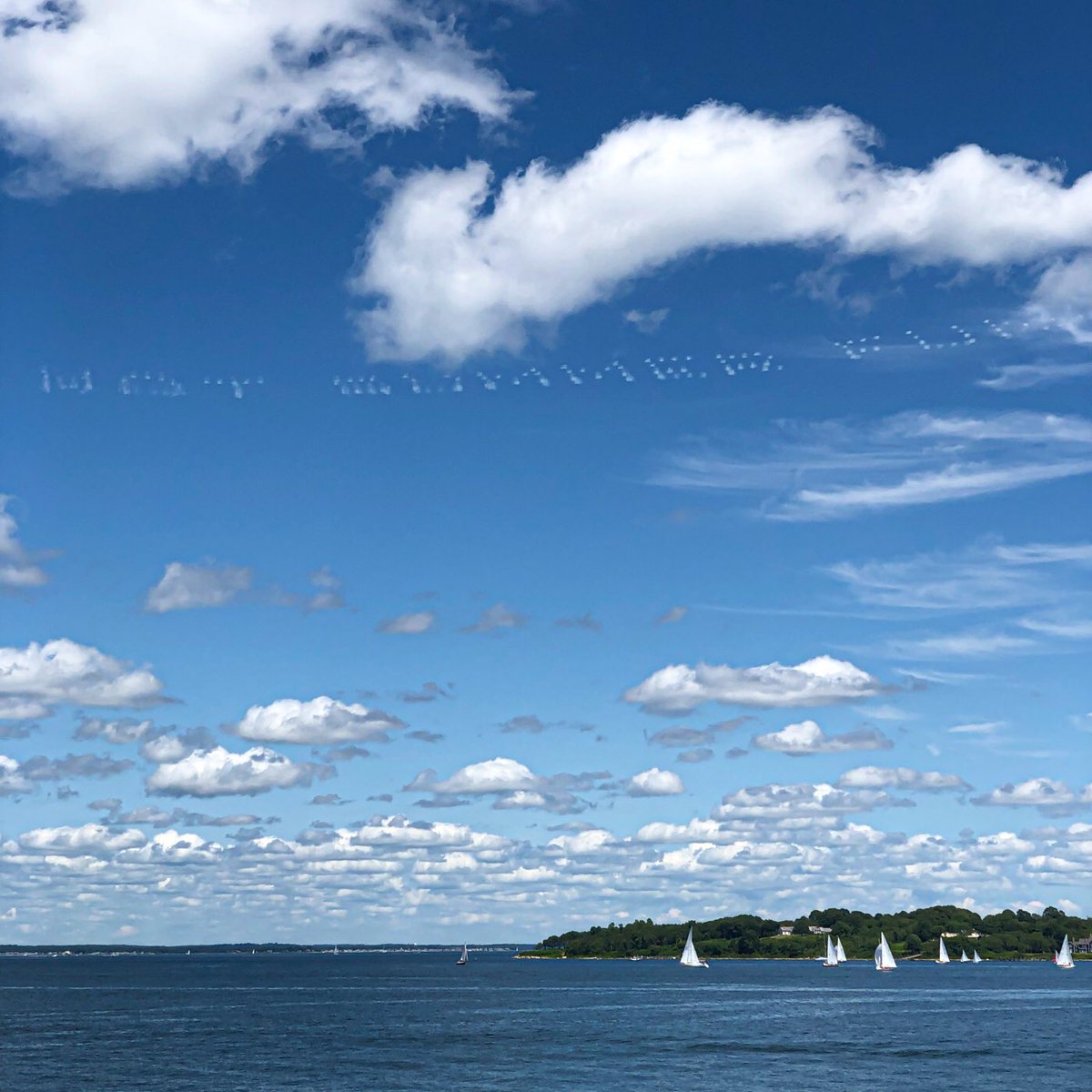 finyphoto's tweet photo. HOT SUMMER FUN

😂 Sky writing that, in a funny coincidence, appeared over the Saturday afternoon races today — it continued on to say, “AT MOHEGAN SUN,” but that seemed angled more for folks on the mainland to see. ⛵️💪

#skywriting #sailing #FishersIsland #FishersIslandNY #FINY https://t.co/wYaHiaEkwj