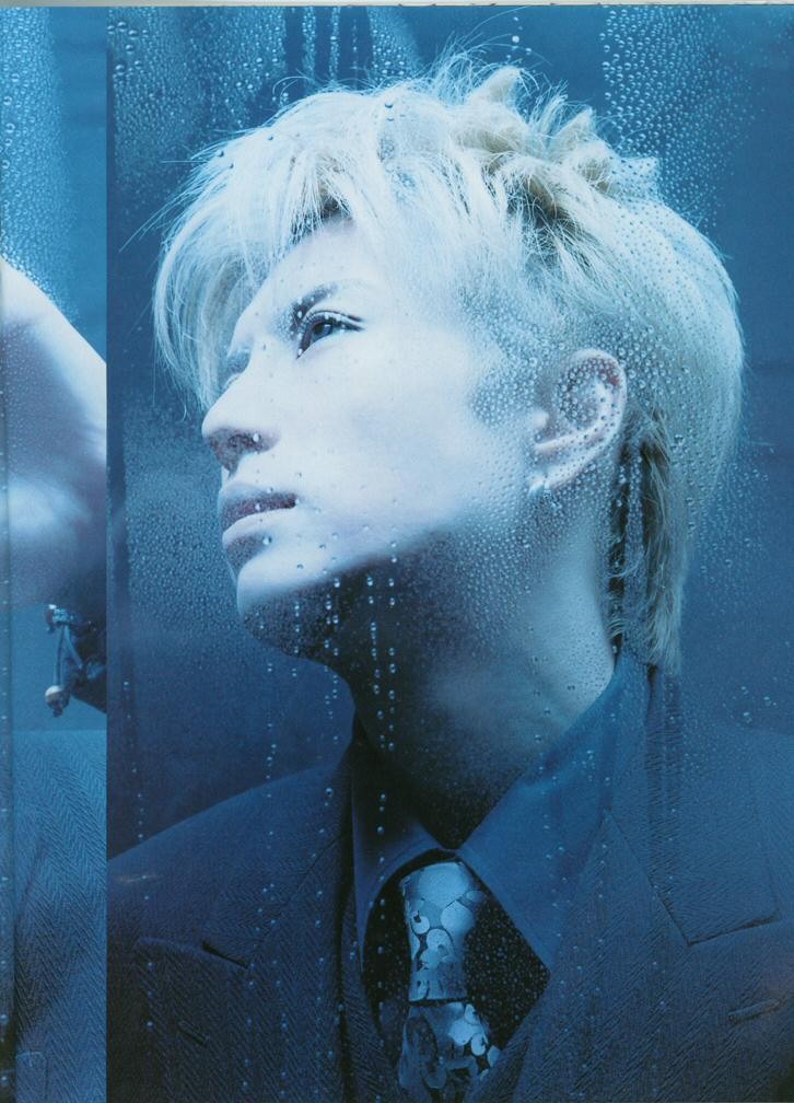 Stands in  his club's shop window... Some people passing by, others watching him closely...

He is bored....