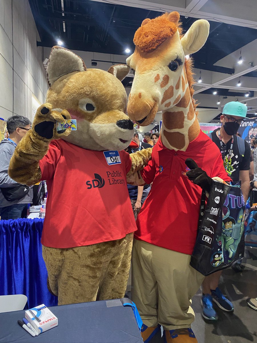 SDPublicLibrary's tweet photo. When worlds collide…a twinning moment at #ComicCon2023—Geoffrey of @ToysRUs took a photo with #OdiTheCoyote! 📸😄 https://t.co/3nOzRj6nzc