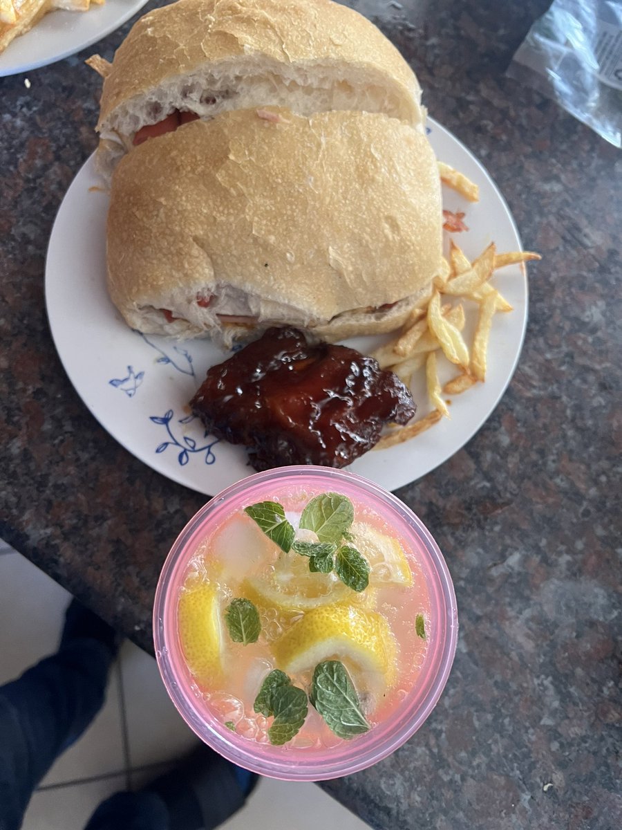 Brunch. English Spahlo. Ingredients are panini, sunny side eggs, atchaar, bacon 🥓, Vienna’s, cheese, Russian, roasted pork and chips 🍟