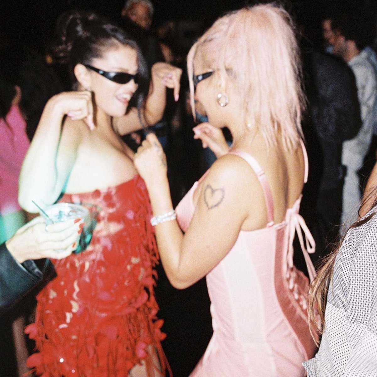 Karol G wearing the “Pink Iconic Dress” from Jean Paul Gaultier at Selena Gomez’s 31st birthday party.