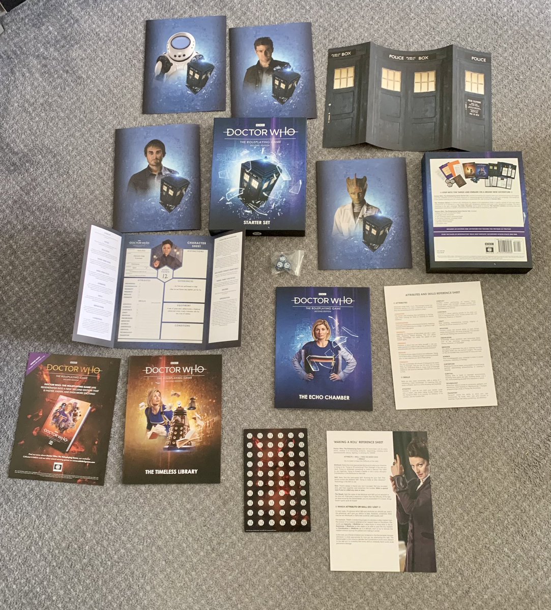 AdamManning's tweet photo. I treated myself to the #DoctorWho #Roleplaying #Game Starter Set on sale in @ForbiddenPlanet and published by @cubicle7. This game has given us so much fun, including roleplaying Mary Queen of Scots, Henry Irving and Davros. #WhoRPG #ttrpg #rpg https://t.co/5Q2Mrs4Fbv