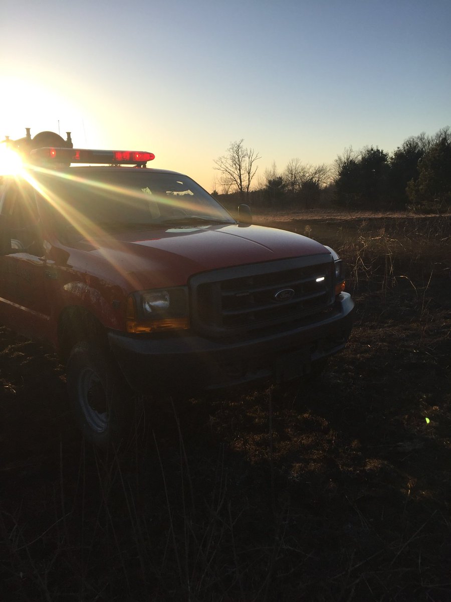 ShellLakeFD's tweet image. Unit 40 in 2017 on a wildland fire with the sun setting.