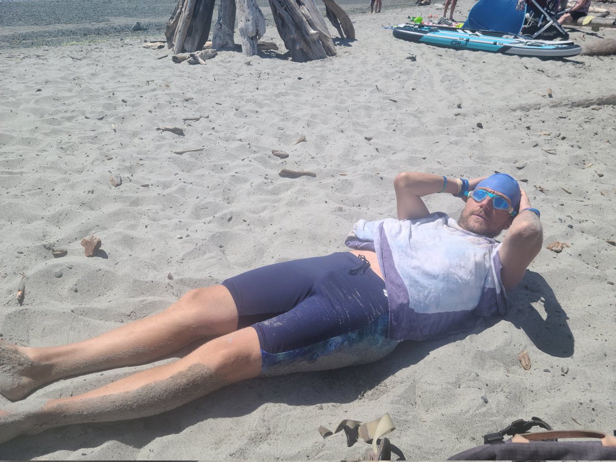 MS_athlete's tweet photo. Great training day for Drew as he prepares for his 35km swim in Lake Cowichan. Here he is warming up in the sand between swim sets.

#autismrules #openwaterswimming #marathonswimming
#disabilities #inclusion #Diversity https://t.co/tCuad6Hca5