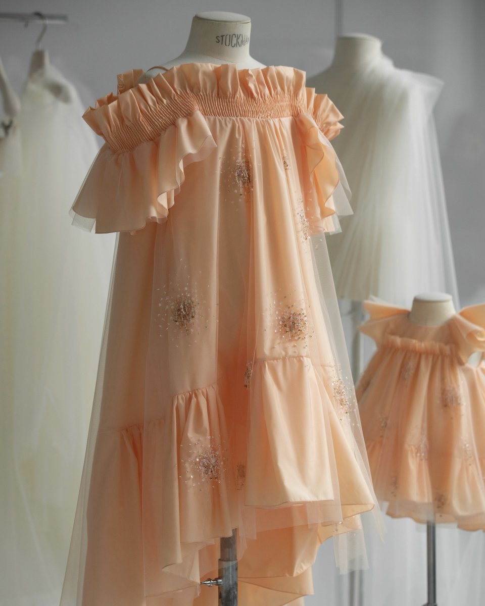 Fairy-tale Dior savoir-faire.
Expertly embellished and edged with whimsical ruffles tracing the hem, sleeves and neckline, a peach-colored #BabyDior couture dress by Cordelia de Castellane comes to life in the Dior Atelier. Discover more on.dior.com/babydior-ig.
