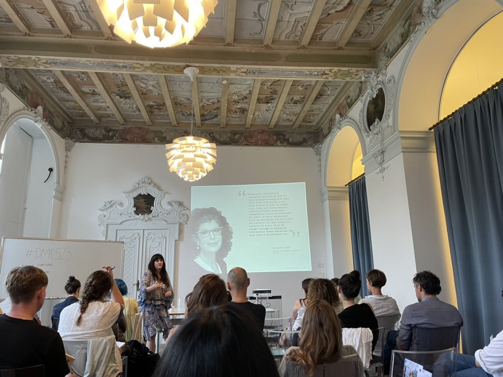 NataliaStanusch's tweet photo. On #surveillancecapitalism, algorithms, and the need to recognize the goals that are already embedded in AI in the context of consumerism. A great keynote @ #DMCS23 https://t.co/XgyRDUVItX