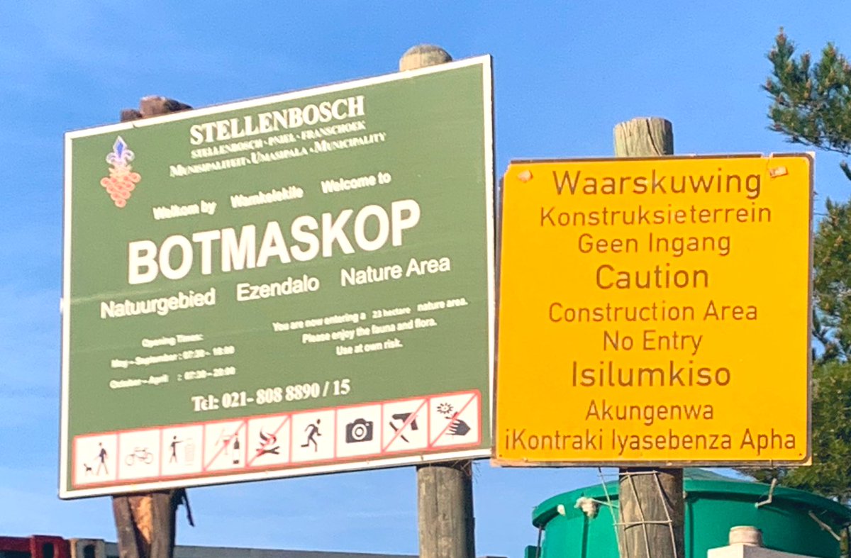 WildPasts_'s tweet photo. They paved paradise …#Botmaskop The irony of the two boards next to each is too much.
Shameful, Stellenbosch. This is a green corridor for wildlife like caracal and porcupine. It’s a place to hike, picnic, ride horses and bike. We don’t need *more* homes for millionaires. https://t.co/LBcpiwAVOi