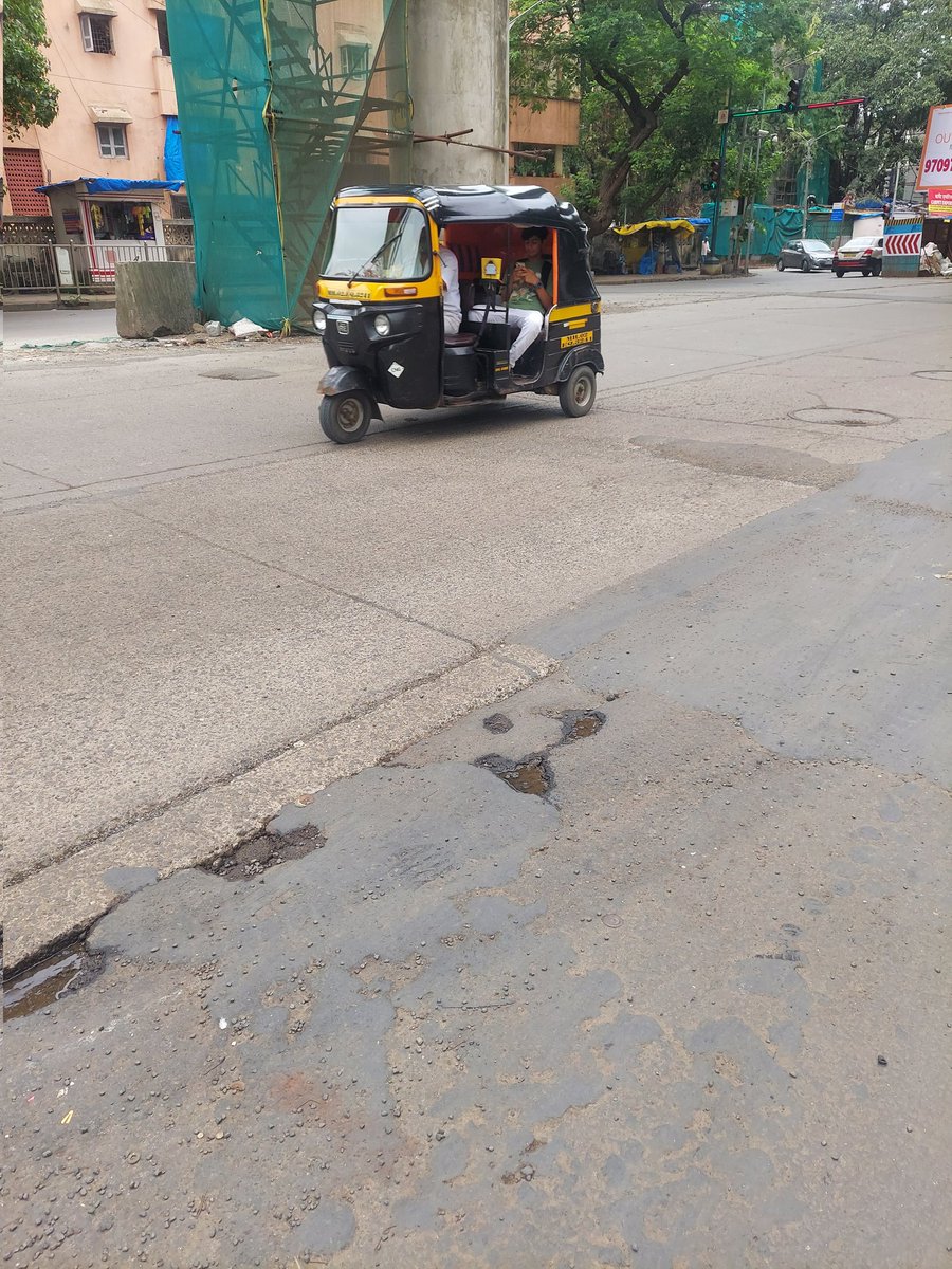 sujayparkar's tweet photo. Rain has washed out the speed breaker on the Cosmopolitan Education  Road, opposite The Club. Please rebuild it to make it easier for school-aged children to cross the street.@mybmcwardKW https://t.co/CWVKClM60v