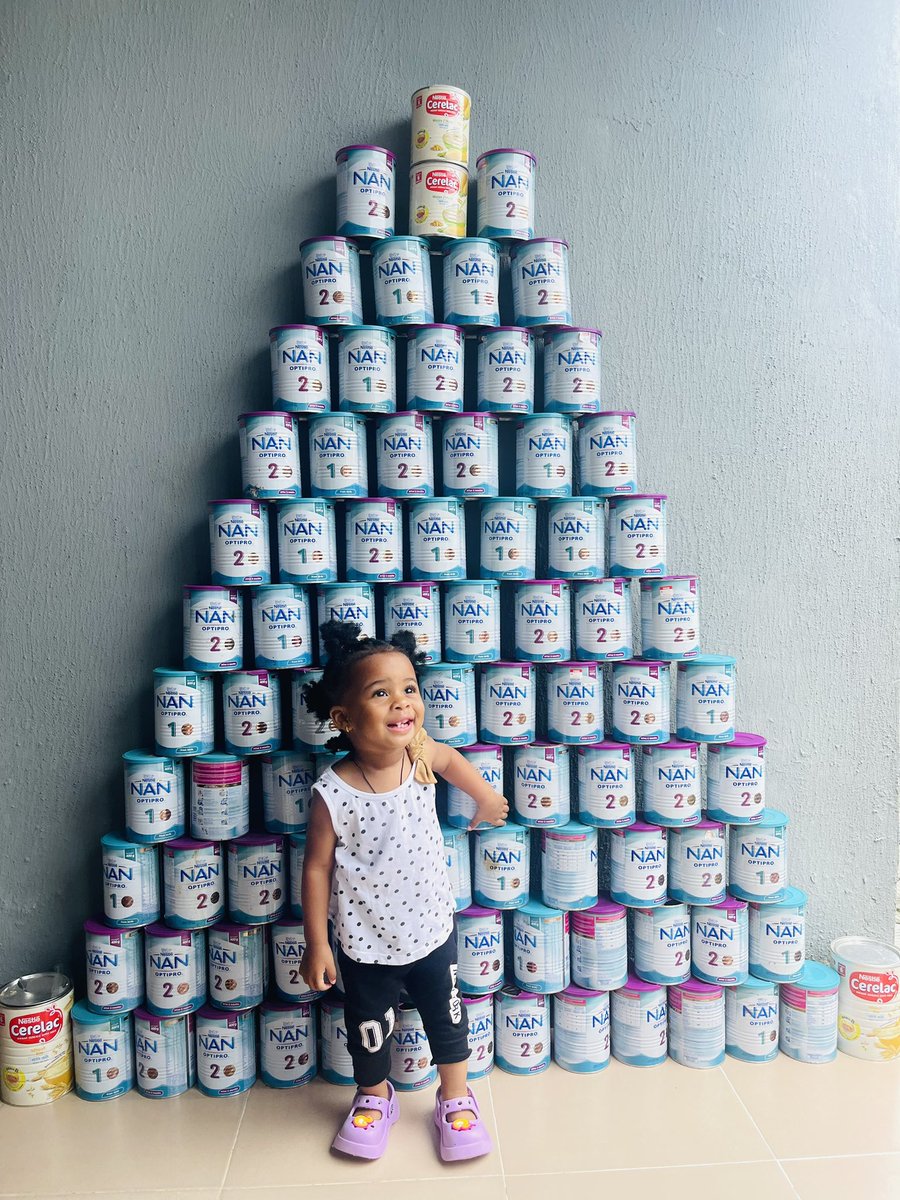 Preciousporche's tweet photo. These are some of the milk we consumed in just 1yr. We discarded some of them before I remembered to start saving them for her to see it when she grows up🤣. She definitely enjoys the milk, and it has contributed so well to her growth. See the way she’s laughing🤣. @Nestle https://t.co/U5238tlPhp