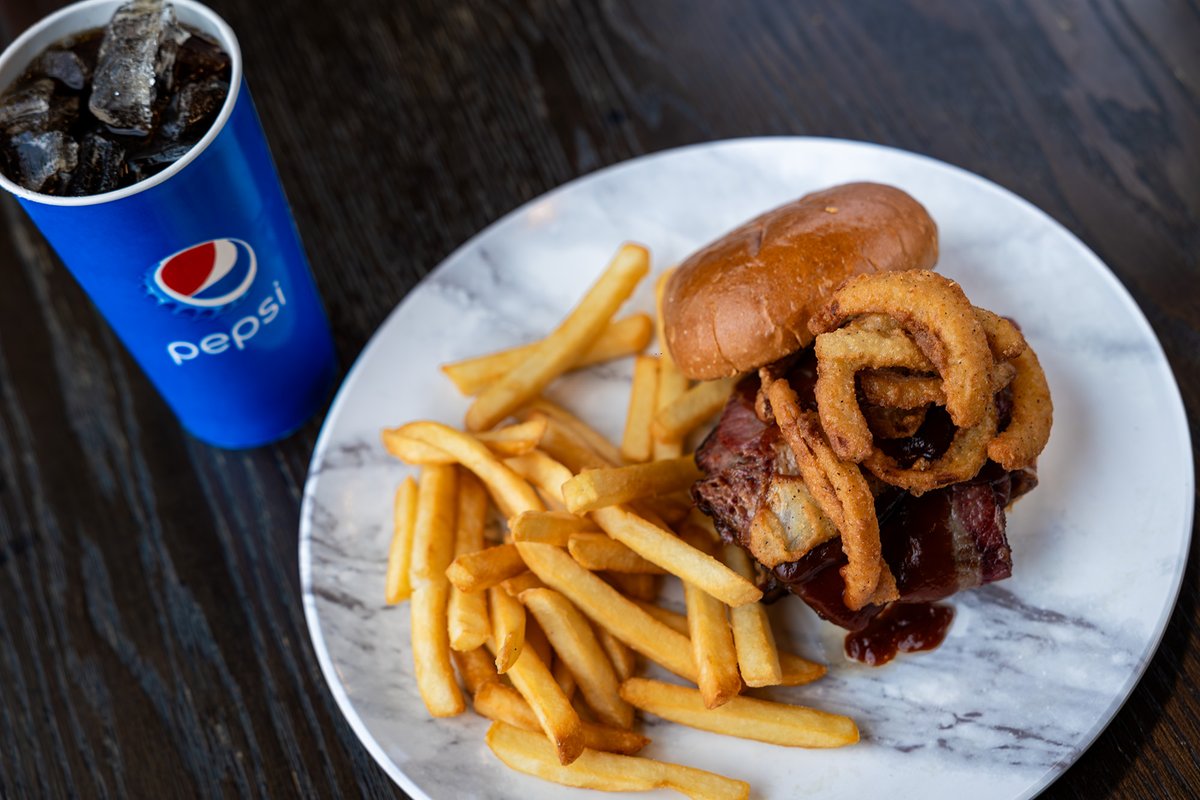 Indulge in burger bliss with Lu's mouthwatering special hamburger, perfectly paired with a refreshing ice-cold cup of Pepsi! 🍔🥤 #BurgerDelights #PepsiPerfection #FoodieHeaven