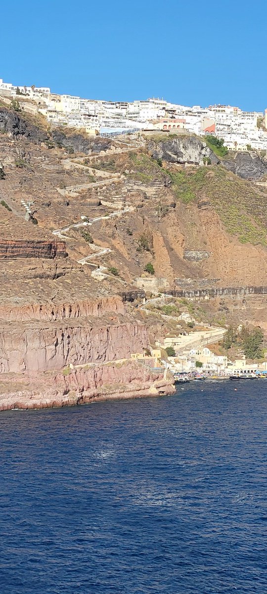 Sitting in the harbor on the <a href="/CruiseNorwegian/">Norwegian Cruise Line</a> #Breakaway at #Santorini, #Greece.  Took the cable cars to the top but walked back down the dangerous path dodging the #donkeys.  Survived to drink another day.