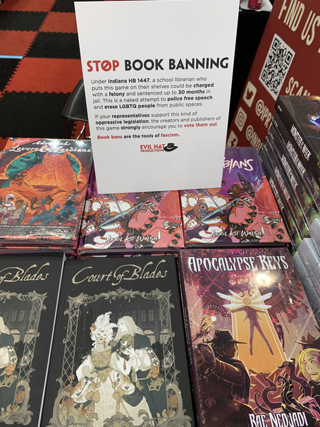 20/20 The Stop Book Banning sign from <a href="/EvilHatOfficial/">Evil Hat Productions</a> displayed atop Thirsty Sword Lesbians, Advanced Lovers and Lesbians, Apocalypse Keys and Court of Blades in #Booth449 at #GenCon2023
You can download your own copy at indiepressrevolution.com/xcart/GenCon-2…