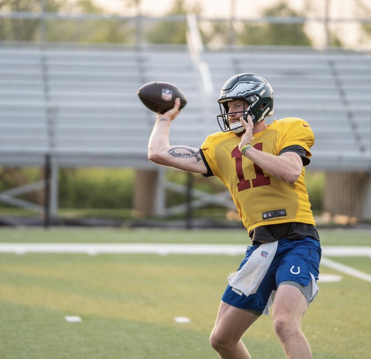 NFL_DovKleiman's tweet photo. Free-agent QB Carson Wentz shared these pictures of him training in a #Commanders jersey, #Eagles helmet, and #Colts shorts, as he's trying to get back to the league.

He captioned the post: "Back in the lab.. just looks a little different so far this year 🙃 #alternateuniforms #trainingcamp2023"