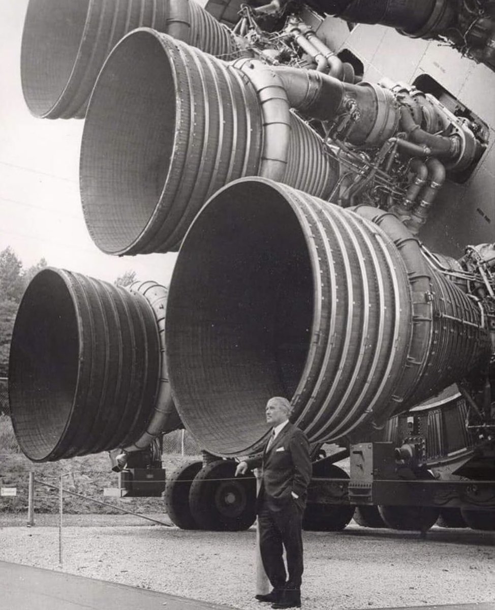 Wernher von Braun standing next to the F-1 Engines which took man to the moon. (1969).