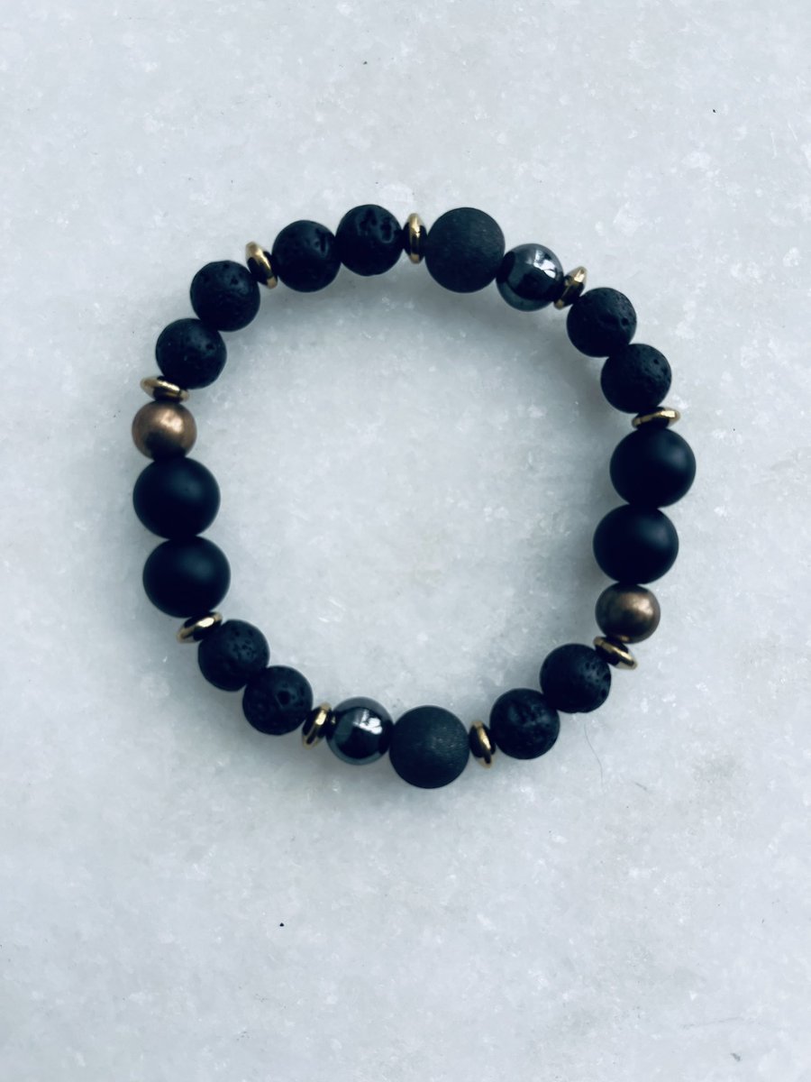 Bellisima_Beads's tweet photo. Wear your scent your way!  Indulge in the perfect blend of fashion and fragrance with this black, bronze and gold bracelet crafted with love and lava beads. https://t.co/YRasLg9Q2b