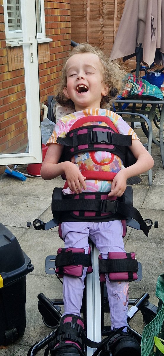 ImogensFight's tweet photo. Dad and Big Sister Brooke were cutting, sawing and decimating the bushes in the garden.

Immy loved joining us whilst in her standing frame. She managed a good hour and a half in it before we came in for lunch.

#CanavanDisease
#Disability https://t.co/0GxKqPeFVl
