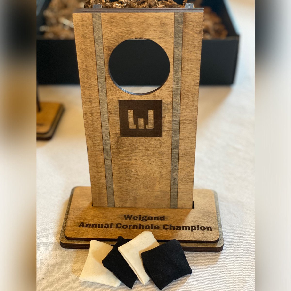 yourpromopeople's tweet image. We recently had these custom cornhole trophies made for  @WeigandConstr's annual cornhole tournament. Instead of just having them function as a trophy though, we made them functional to use as a tabletop cornhole game!