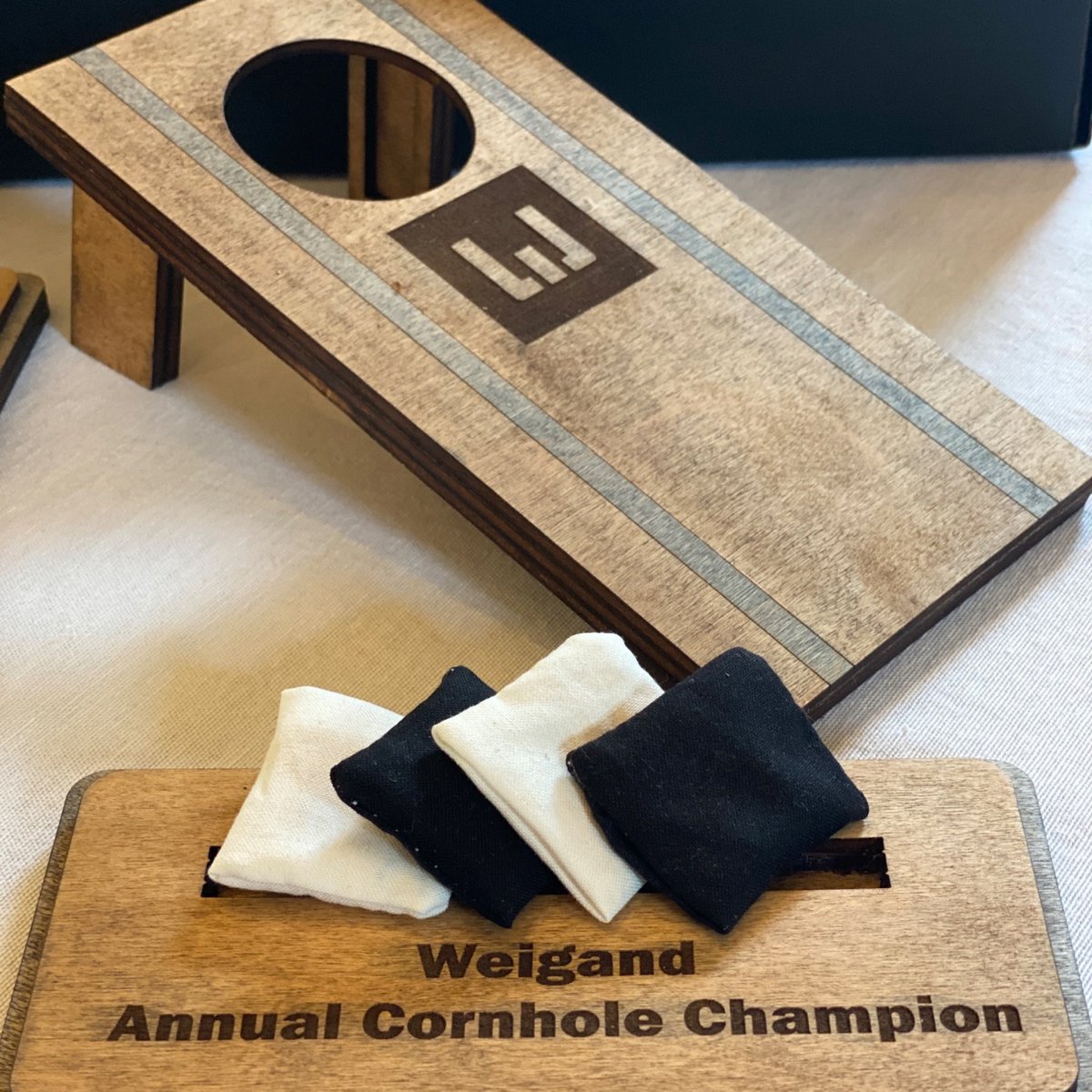 yourpromopeople's tweet image. We recently had these custom cornhole trophies made for  @WeigandConstr's annual cornhole tournament. Instead of just having them function as a trophy though, we made them functional to use as a tabletop cornhole game!