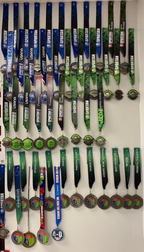 UM4Lyfe's tweet photo. I’m running out of room on my wall. #MysticJay only knows dubs. I don’t take participation metals. If I don’t win or a podium, I throw them in the trash I won’t even take it, but this is why I am the OCR guy for the org. #StayMistic https://t.co/tXsIYecl0v