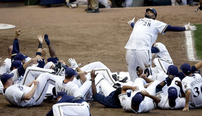 Brewers players fall to the ground after Prince Fielder jumps on home plate after a walk off home run, 2009