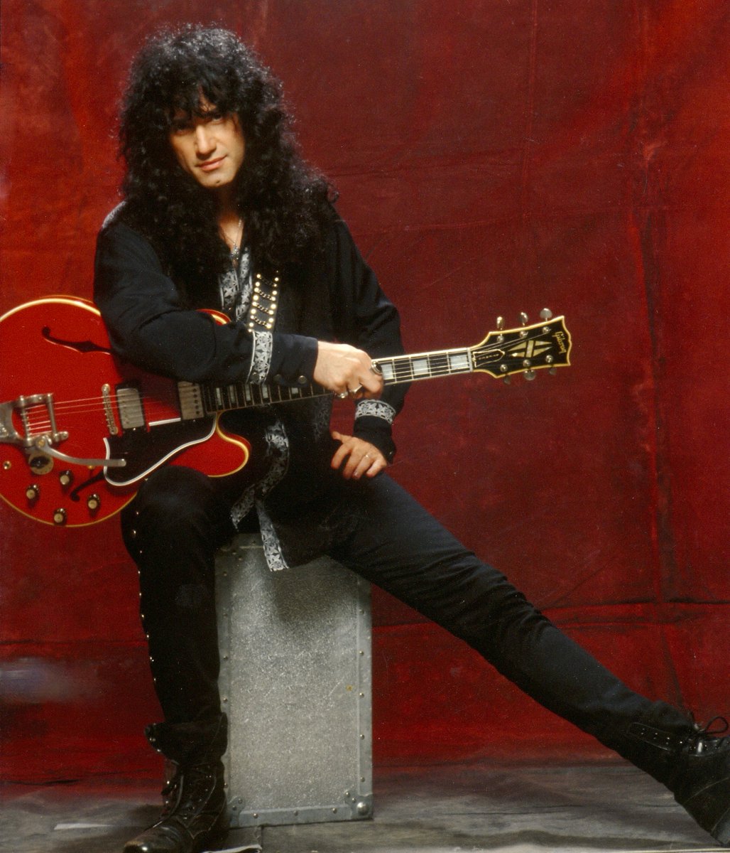 Colorful Gibson guitar, what model? What year? Where did it appear with KISS? Photo by Marty Temme. (I really have long legs huh!)<a href="/UltimateRockPix/">Marty Temme</a>