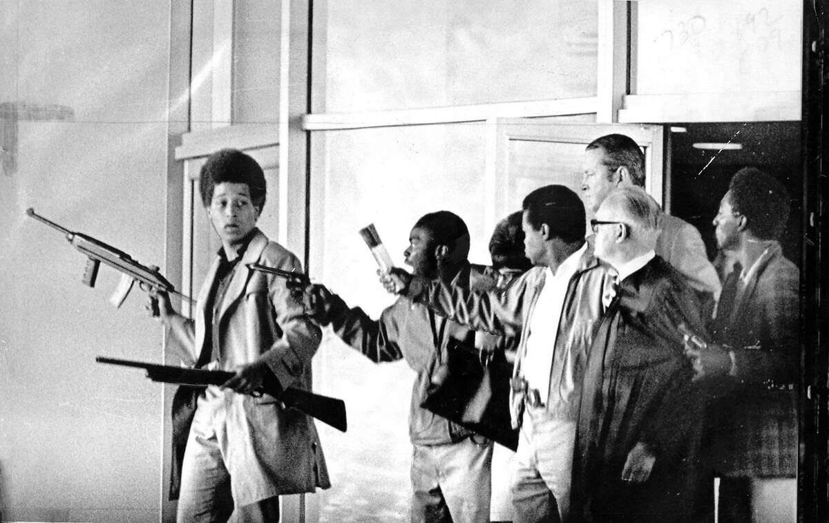 kinfolktech's tweet photo. On August 7, 1970, 53 years ago today,  17-year old Jonathan Peter Jackson, brother of George Jackson, brought 3 guns into the Marin County Hall of Justice, where Judge Haley was presiding over the trial of San Quentin prisoner James McClain. He drew weapons from his satchel, and with the assistance of McClain and 2 prisoners who were witnesses for McClain, Ruchell Magee and William A. Christmas, took Judge Haley, Deputy District Attorney Gary Thomas and 3 female jurors hostage.