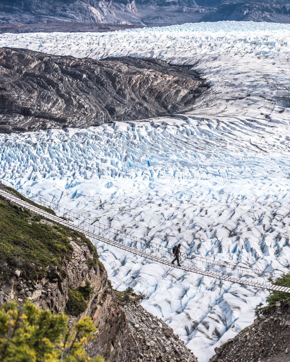 Crossing one of the hanging bridges on the Torres del Paine “O” Circuit near the legendary John Gardner Pass. Would you dare walking here? 😍 (📸 <a href="/tdhalleine/">Timothy Dhalleine</a>) #Chile